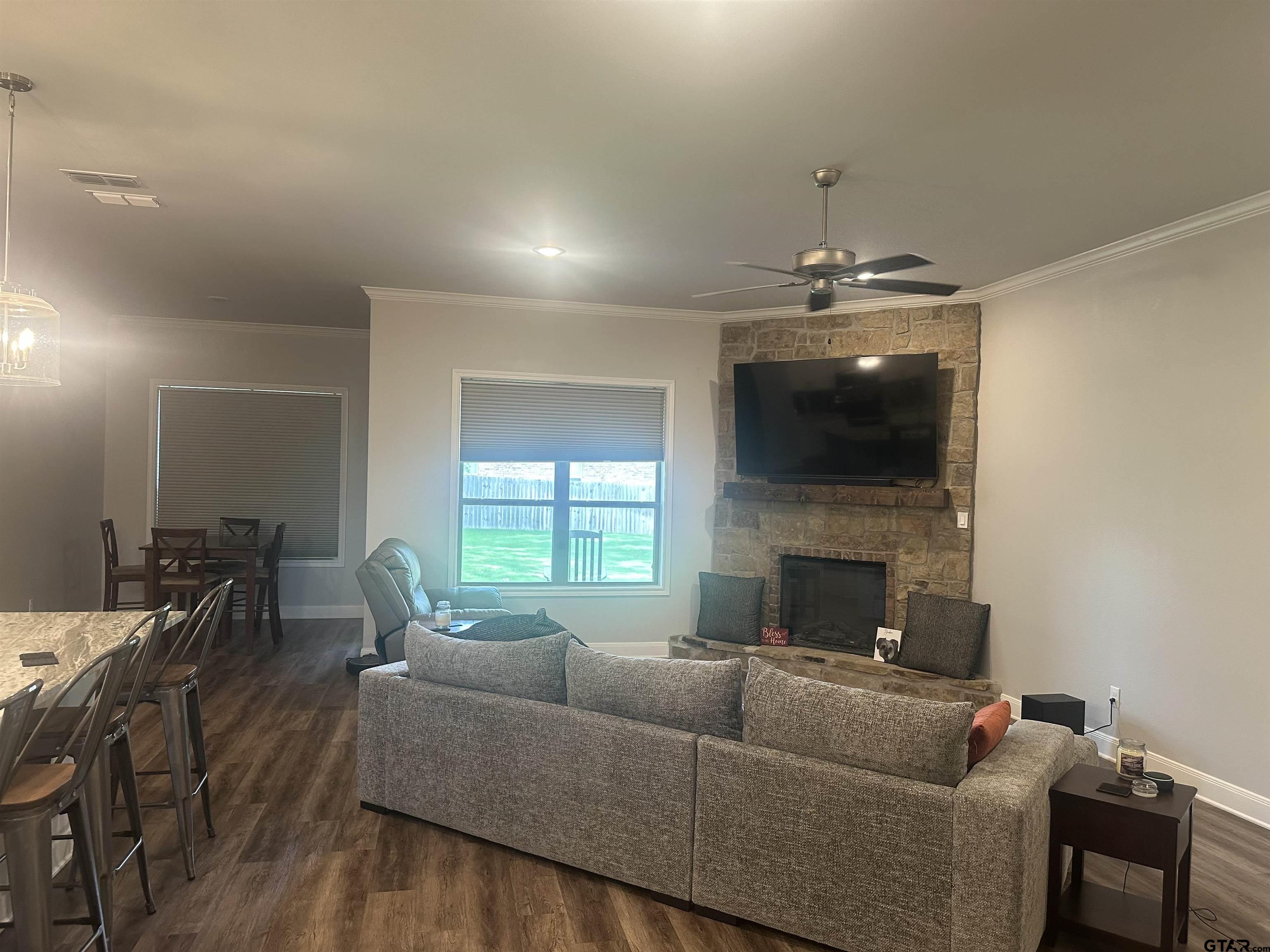 411 Deer Point Cove Chandler, TX 75758 - Photo 2 of 21 a living room with furniture and a fireplace