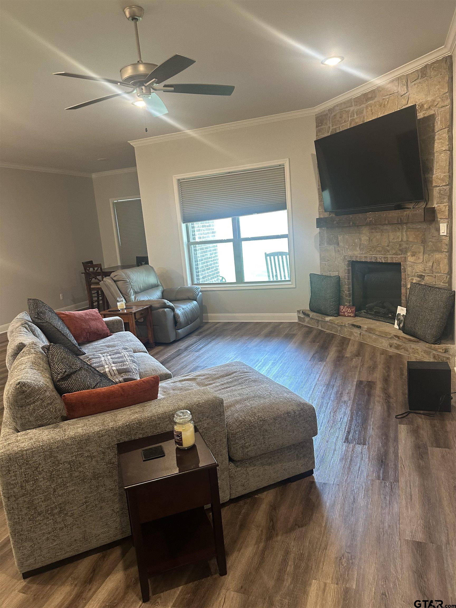 411 Deer Point Cove Chandler, TX 75758 - Photo 3 of 21 a living room with furniture and a flat screen tv