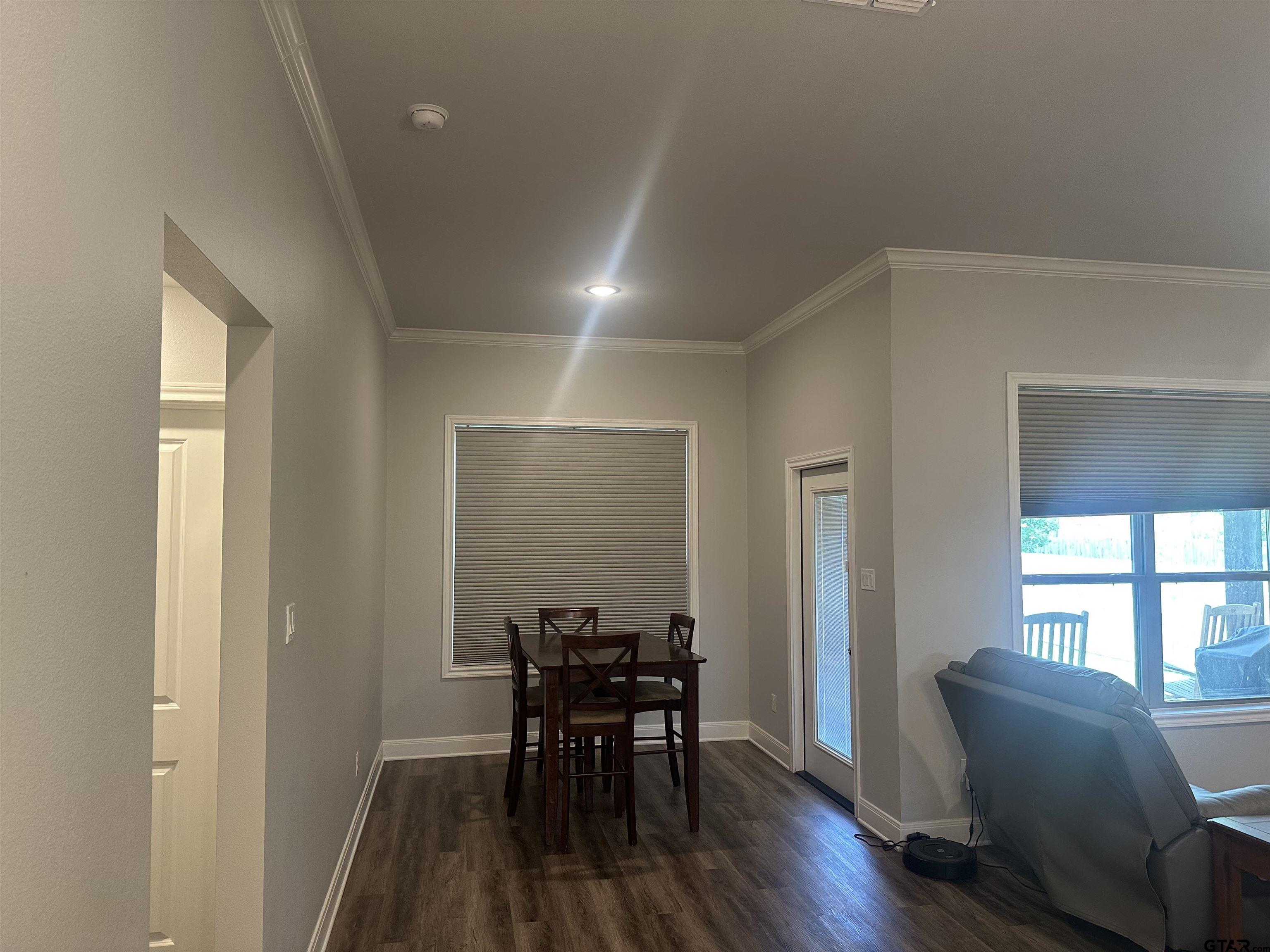 411 Deer Point Cove Chandler, TX 75758 - Photo 6 of 21 a view of a dining room with furniture and wooden floor