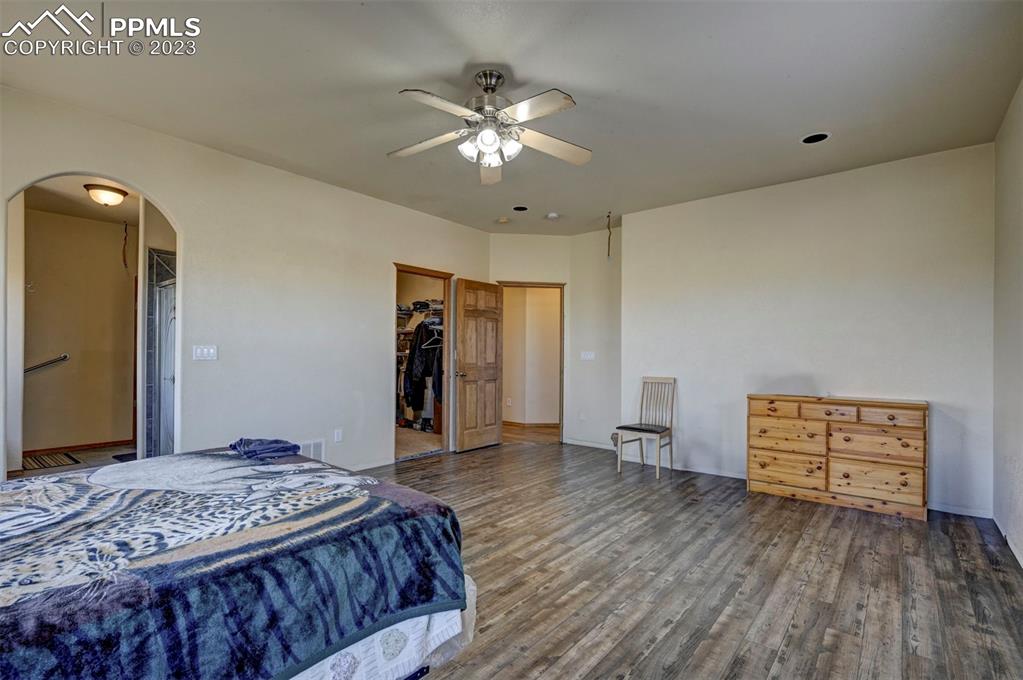 31790 Sanborn Road Yoder, CO 80864 - Photo 15 of 50 a bedroom with a bed and a dresser