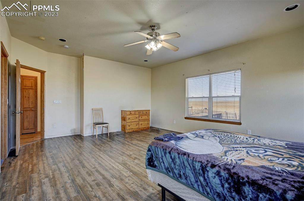31790 Sanborn Road Yoder, CO 80864 - Photo 16 of 50 a bed sitting in a bedroom next to a window