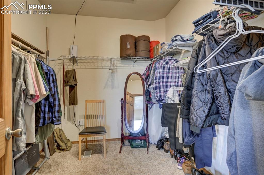 31790 Sanborn Road Yoder, CO 80864 - Photo 21 of 50 a view of walk in closet with clothes