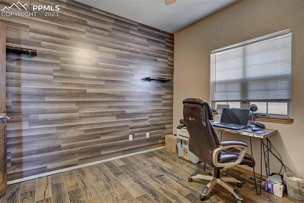 31790 Sanborn Road Yoder, CO 80864 - Photo 25 of 50 a view of a workspace with furniture and a window