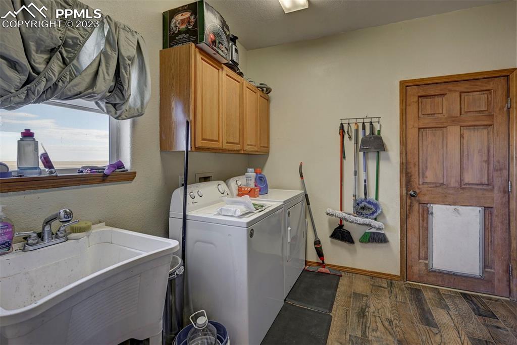 31790 Sanborn Road Yoder, CO 80864 - Photo 27 of 50 a view of storage and utility room with a sink