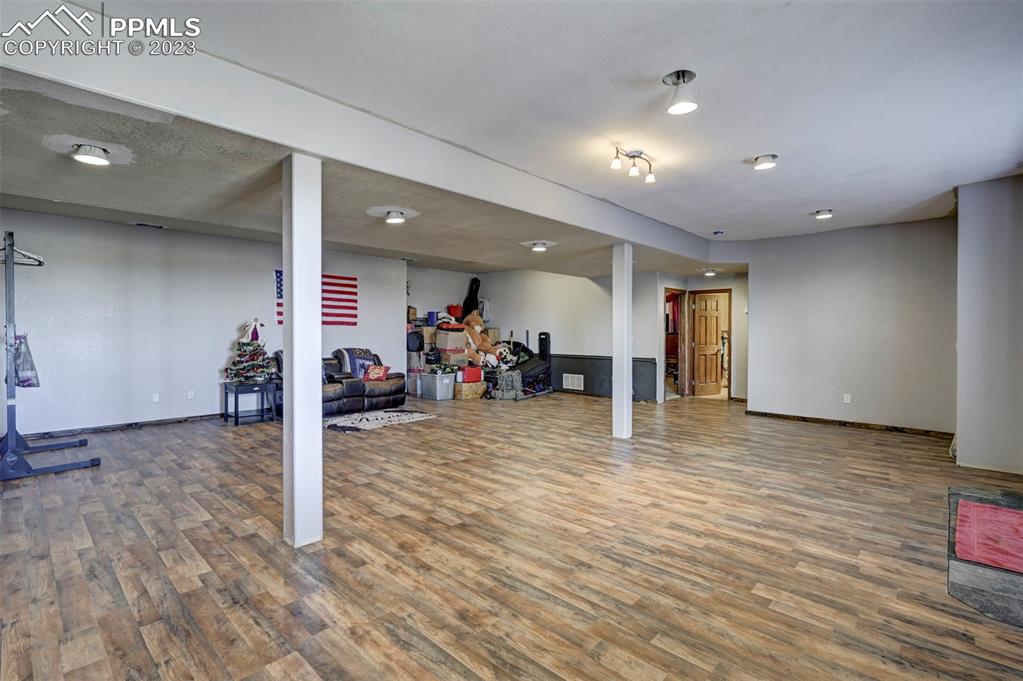 31790 Sanborn Road Yoder, CO 80864 - Photo 30 of 50 a view of a room with wooden floor