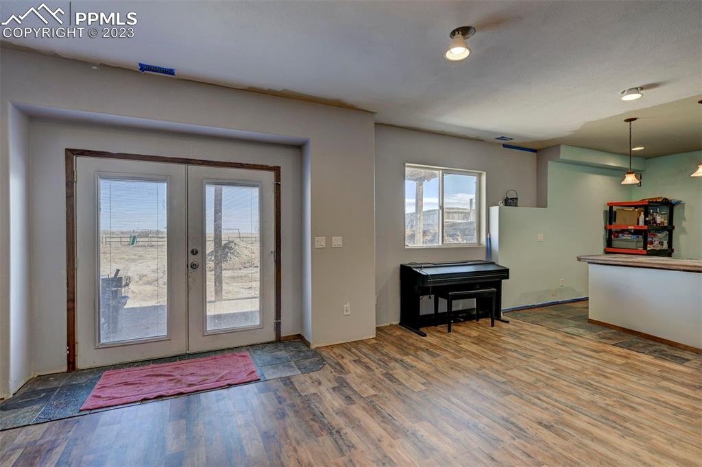 31790 Sanborn Road Yoder, CO 80864 - Photo 31 of 50 an empty room with chair and windows