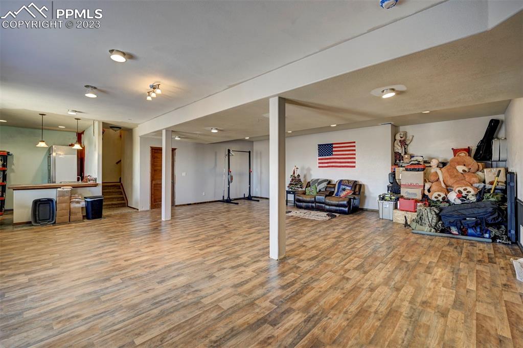 31790 Sanborn Road Yoder, CO 80864 - Photo 32 of 50 a view of a room with gym equipment and a large window