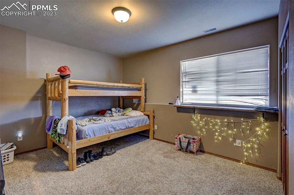 31790 Sanborn Road Yoder, CO 80864 - Photo 35 of 50 a bedroom with a bed and a window