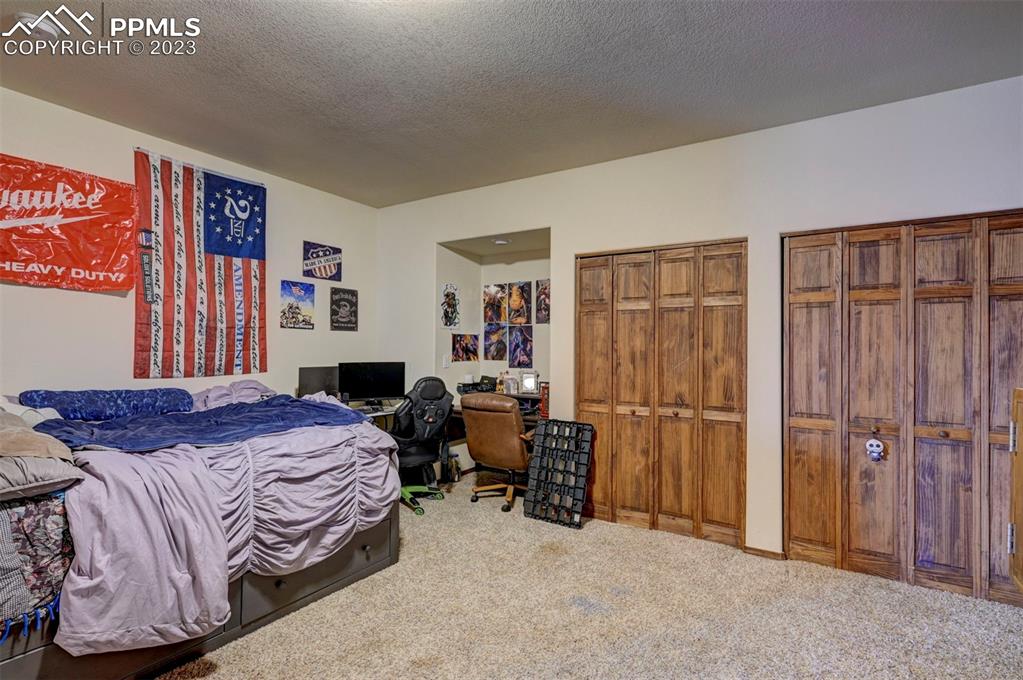 31790 Sanborn Road Yoder, CO 80864 - Photo 39 of 50 a bedroom with a bed and a window