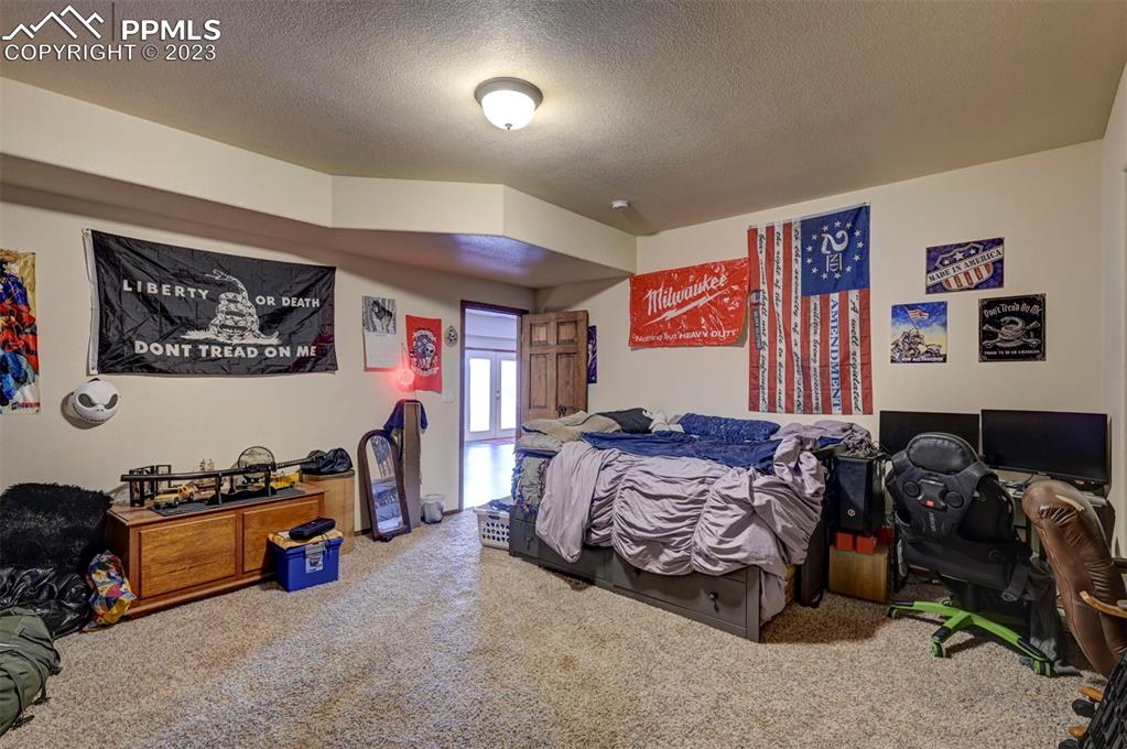 31790 Sanborn Road Yoder, CO 80864 - Photo 40 of 50 a bed room with furniture and a closet