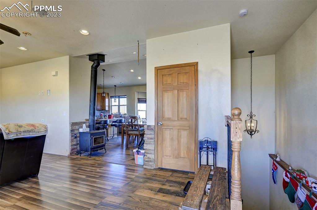 31790 Sanborn Road Yoder, CO 80864 - Photo 4 of 50 a view of a dining room with furniture window and wooden floor