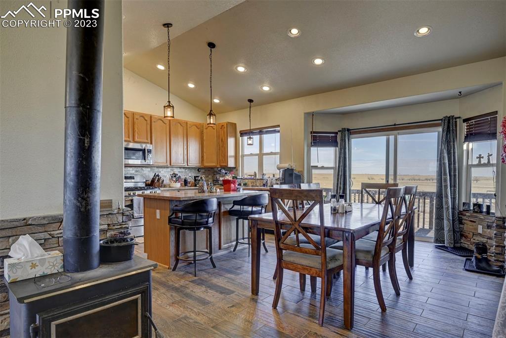 31790 Sanborn Road Yoder, CO 80864 - Photo 7 of 50 a view of a dining room with furniture window and wooden floor