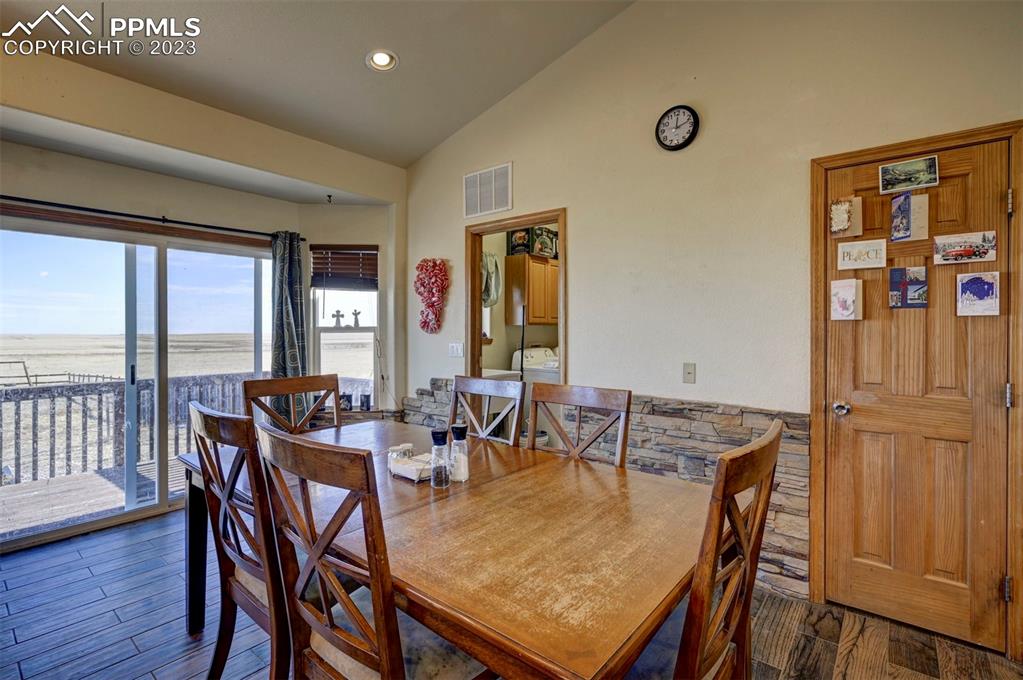 31790 Sanborn Road Yoder, CO 80864 - Photo 9 of 50 a view of a dining room with furniture window and wooden floor