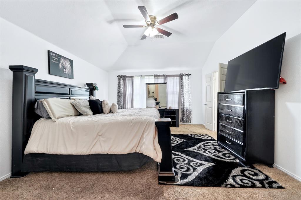 511 Chestnut Trail Forney, TX 75126 - Photo 23 of 32 Vaulted ceilings with a ceiling fan, carpeted flooring, and white walls