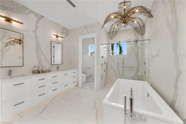 a bathroom with a bathtub and a sink