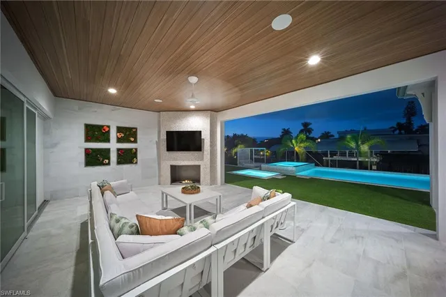 a outdoor space with a large window and couches