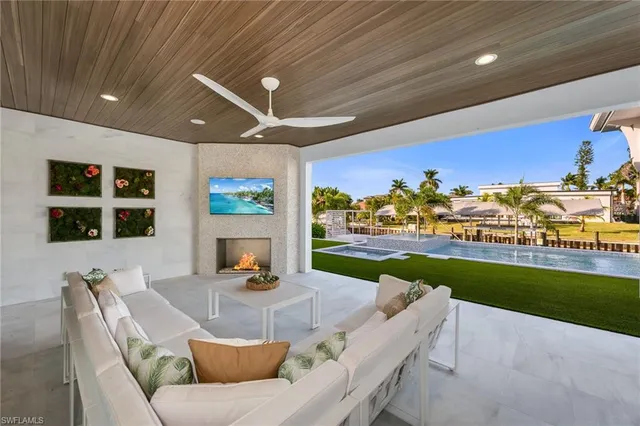 a view of a backyard patio and swimming pool