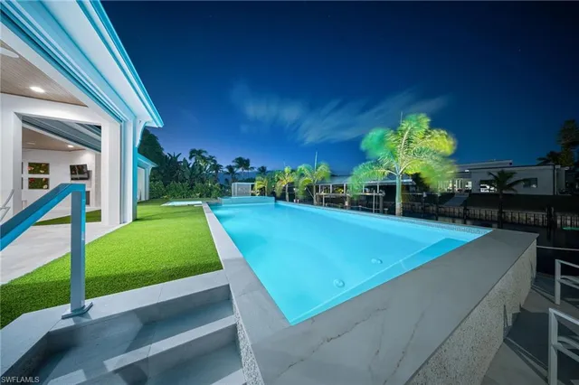 a view of a house with a backyard porch and sitting area