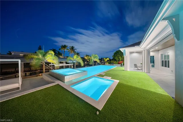 a view of a swimming pool with a patio