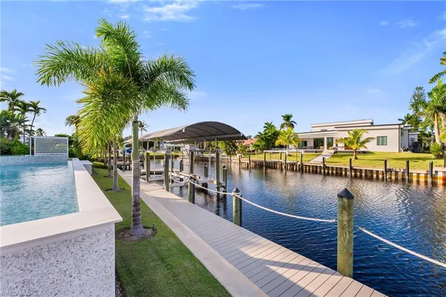 a view of swimming pool with a lounge chair