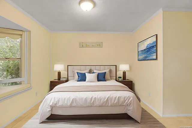 a bedroom with bed and window