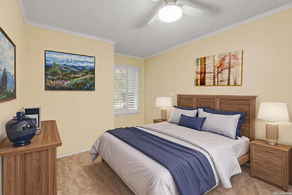 a bedroom with bed and wooden floor