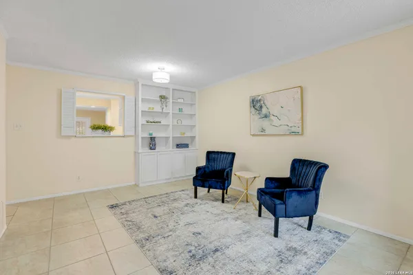 a view of a livingroom with furniture and a workspace