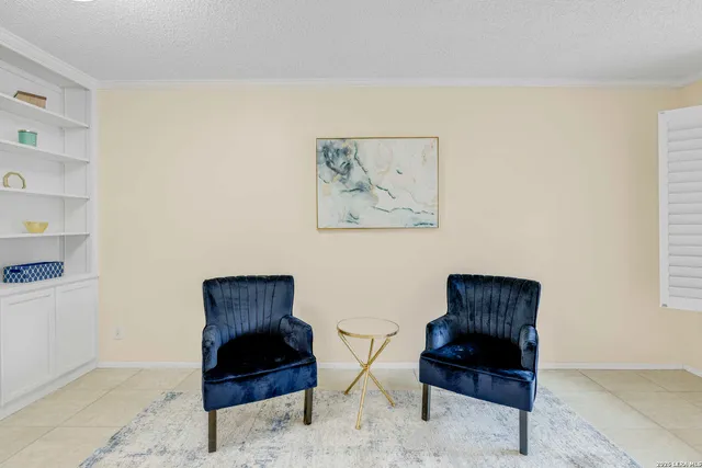 a living room with furniture and a rug