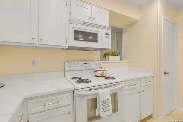 a kitchen with cabinets and appliances