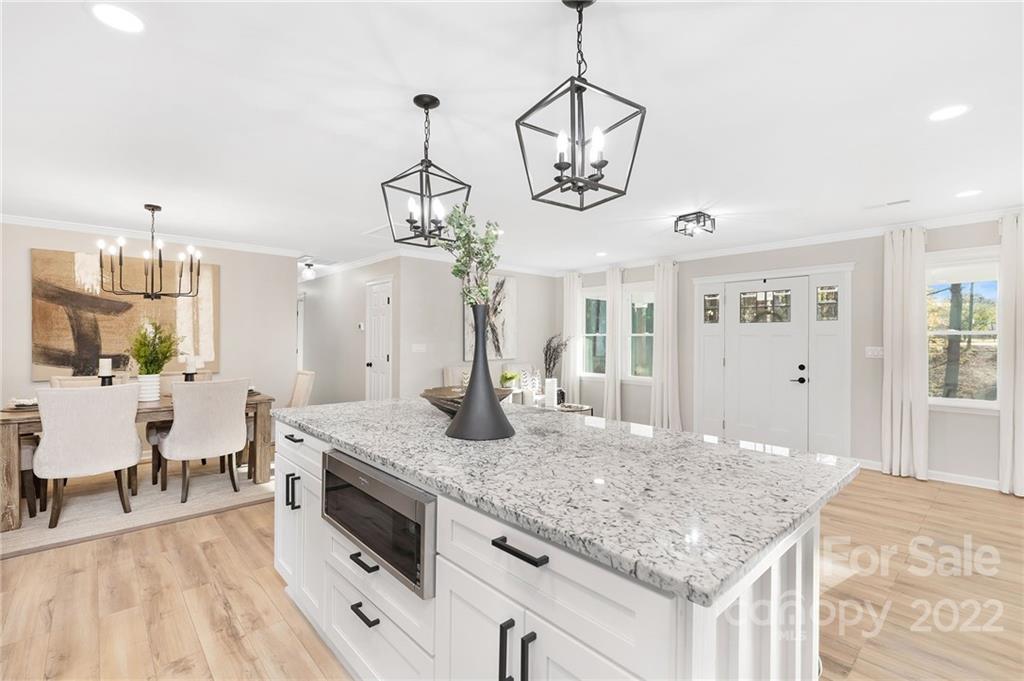 2606 Holbrook Road Fort Mill, SC 29715 - Photo 12 of 23 a view of a center island and chandelier
