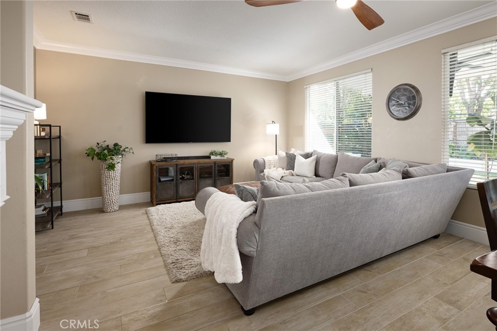 32 Berlamo Rancho Santa Margarita, CA 92688 - Photo 11 of 59 a living room with furniture and a flat screen tv