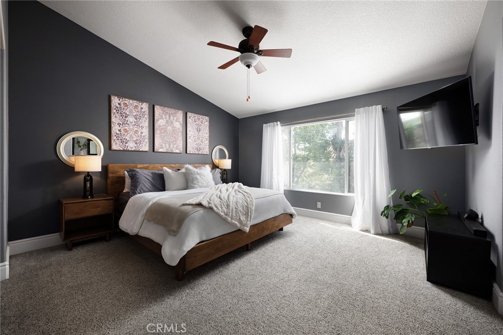 32 Berlamo Rancho Santa Margarita, CA 92688 - Photo 13 of 59 a bed sitting in a spacious bedroom next to a window