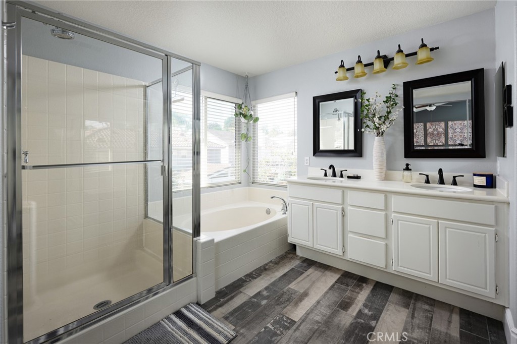 32 Berlamo Rancho Santa Margarita, CA 92688 - Photo 16 of 59 a spacious bathroom with 2 sink tub and a mirror