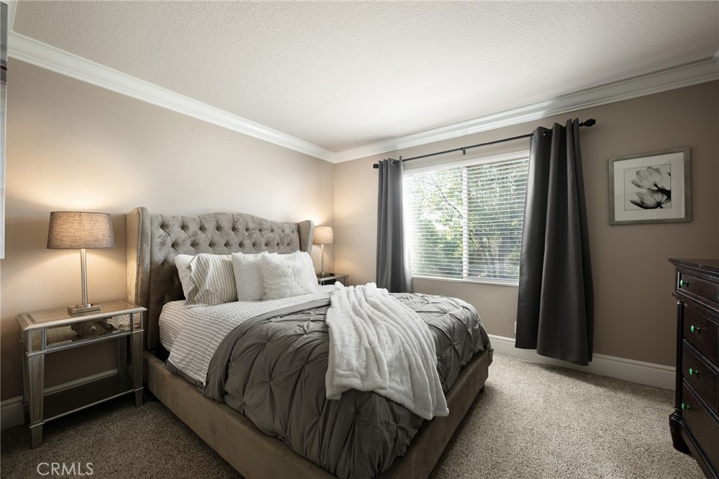 32 Berlamo Rancho Santa Margarita, CA 92688 - Photo 18 of 59 a bedroom with a bed and a window