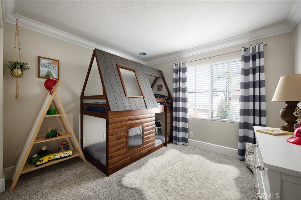 32 Berlamo Rancho Santa Margarita, CA 92688 - Photo 20 of 59 a bedroom with furniture and a window