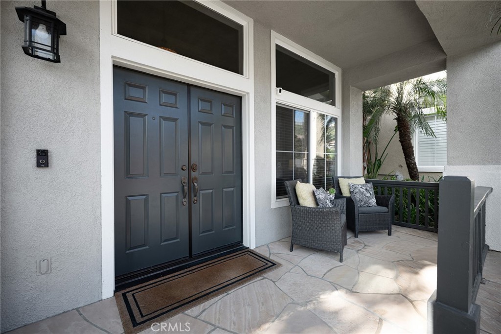 32 Berlamo Rancho Santa Margarita, CA 92688 - Photo 34 of 59 a view of an entryway door and outdoor seating