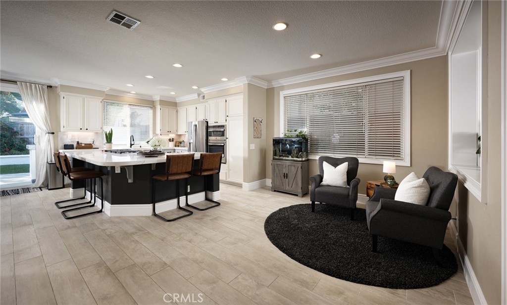 32 Berlamo Rancho Santa Margarita, CA 92688 - Photo 7 of 59 a living room with furniture and a large window