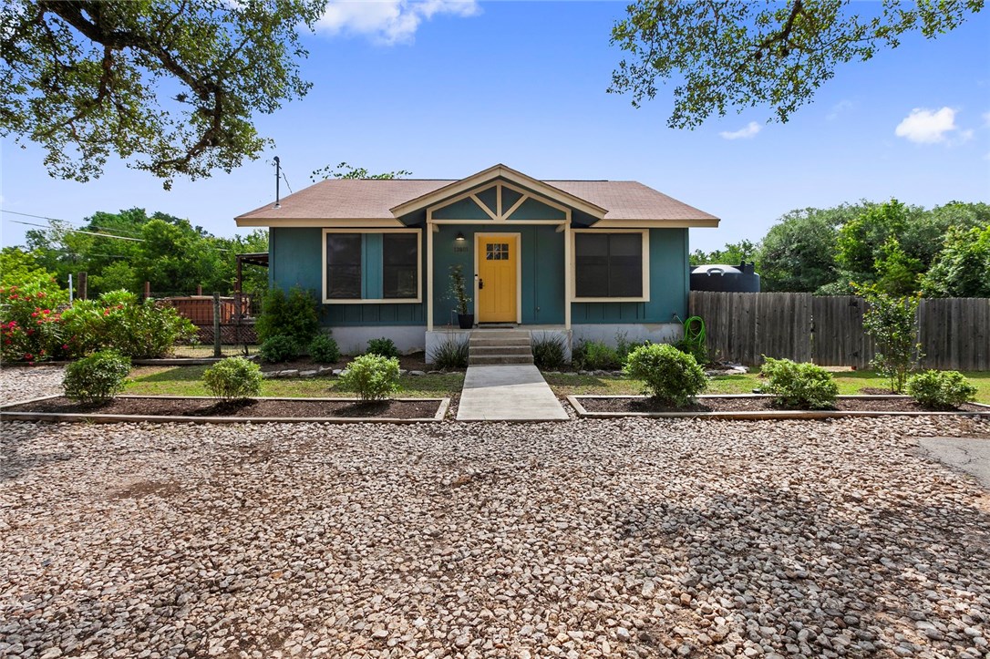 13801 Nutty Brown Road Austin, TX 78737 - Photo 1 of 1 a front view of a house with a yard and garage