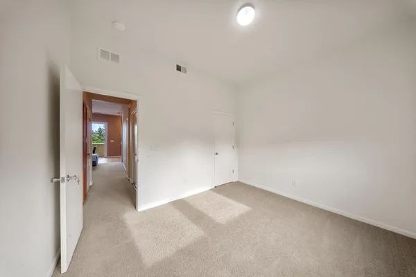 a view of a room with a hallway