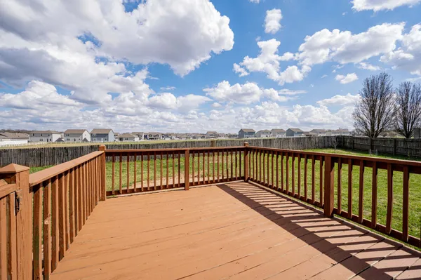 a view of balcony with wooden floor