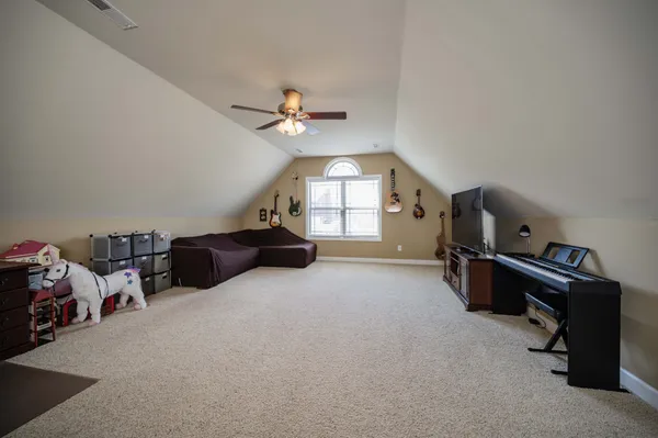 a view of a livingroom with furniture and a flat screen tv