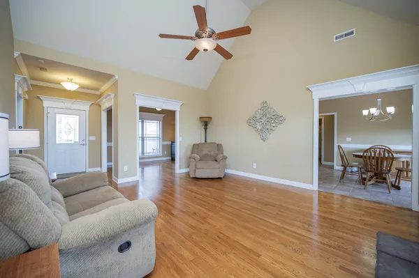 a living room with furniture fireplace and flat screen tv