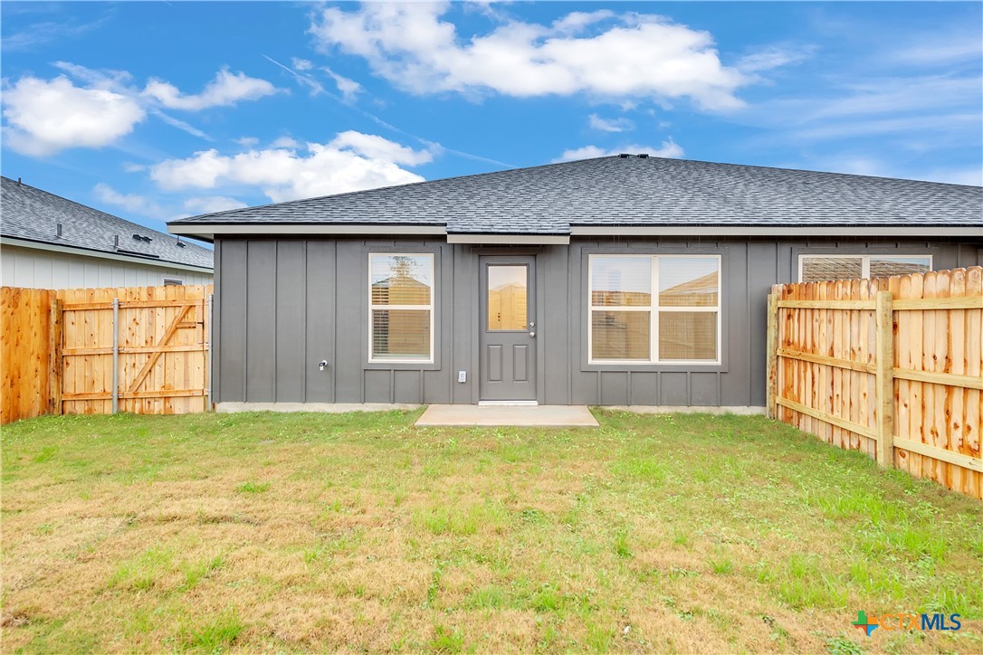 909 Wax Myrtle Court, Unit B Killeen, TX 76543 - Photo 15 of 15 a view of a backyard with a large tree