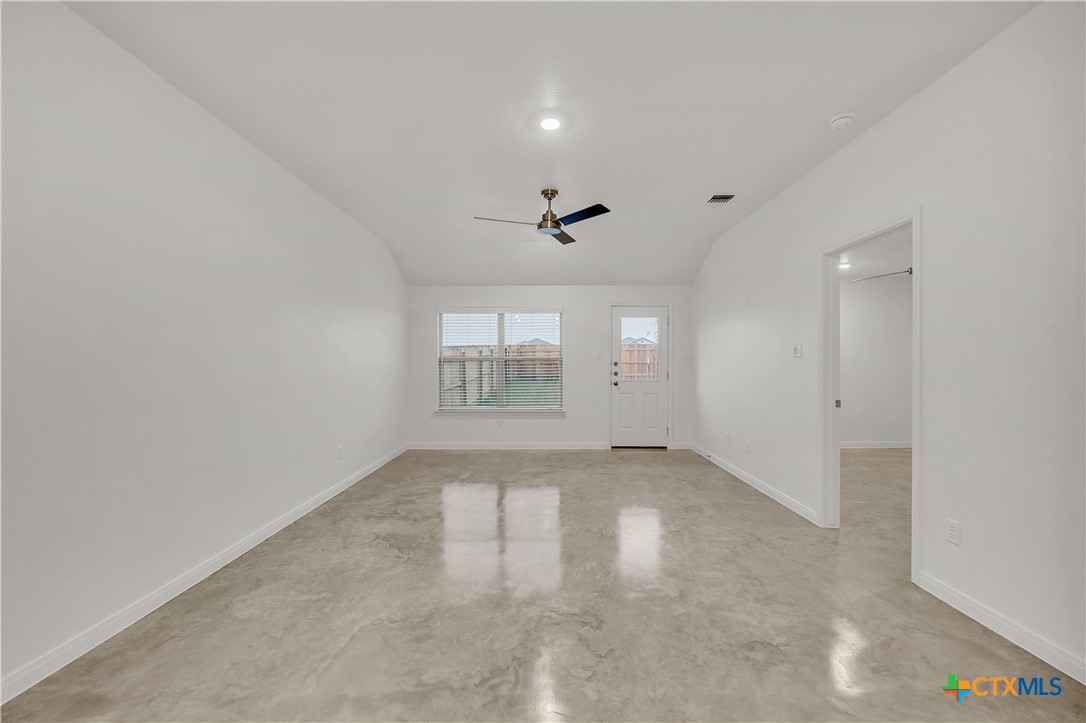 909 Wax Myrtle Court, Unit B Killeen, TX 76543 - Photo 3 of 15 an empty room with a empty space and windows