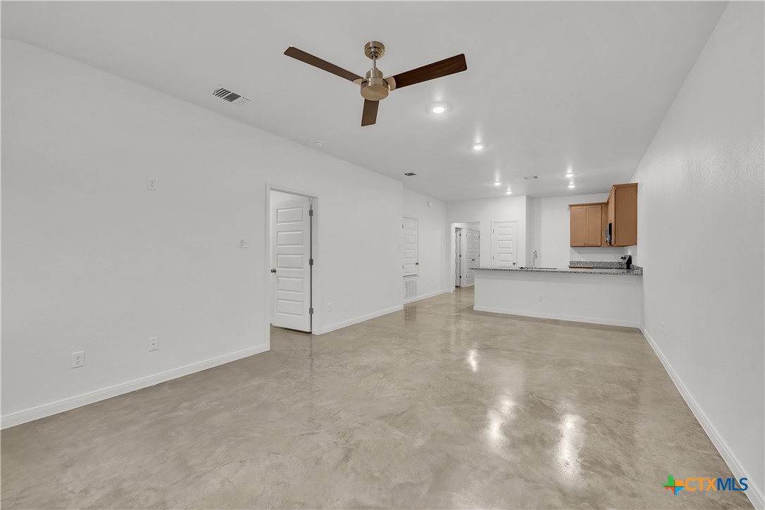 909 Wax Myrtle Court, Unit B Killeen, TX 76543 - Photo 4 of 15 a view of a kitchen with a sink and a refrigerator