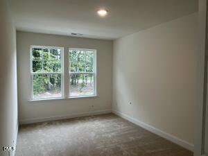 6419 Granite Quarry Drive Raleigh, NC 27610 - Photo 12 of 53 an empty room with a window