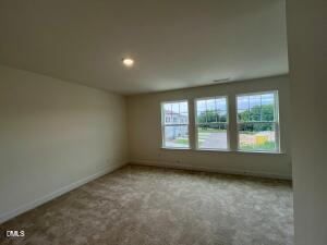 6419 Granite Quarry Drive Raleigh, NC 27610 - Photo 14 of 53 an empty room with a window