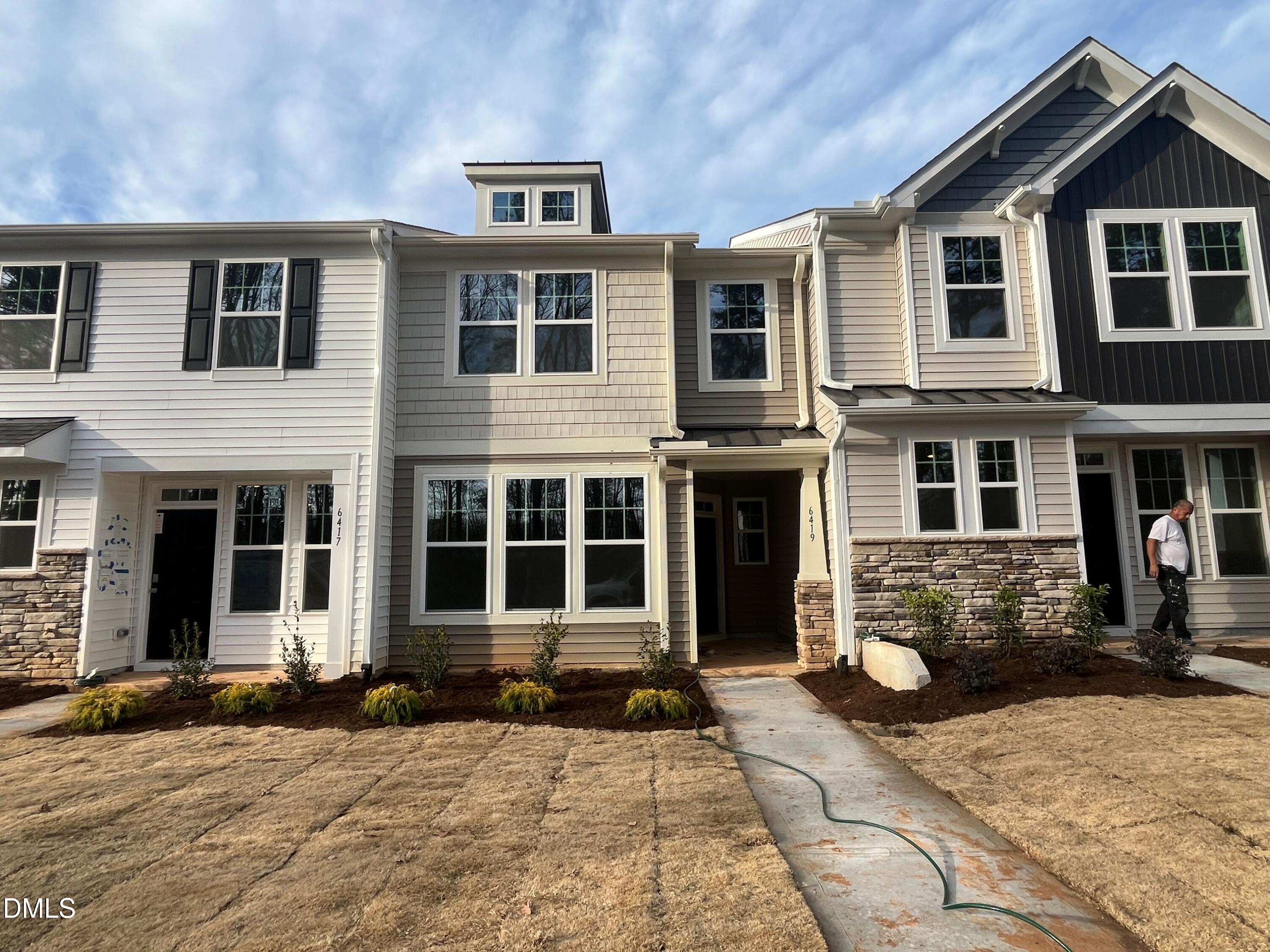 6419 Granite Quarry Drive Raleigh, NC 27610 - Photo 3 of 53 a front view of a house with a yard
