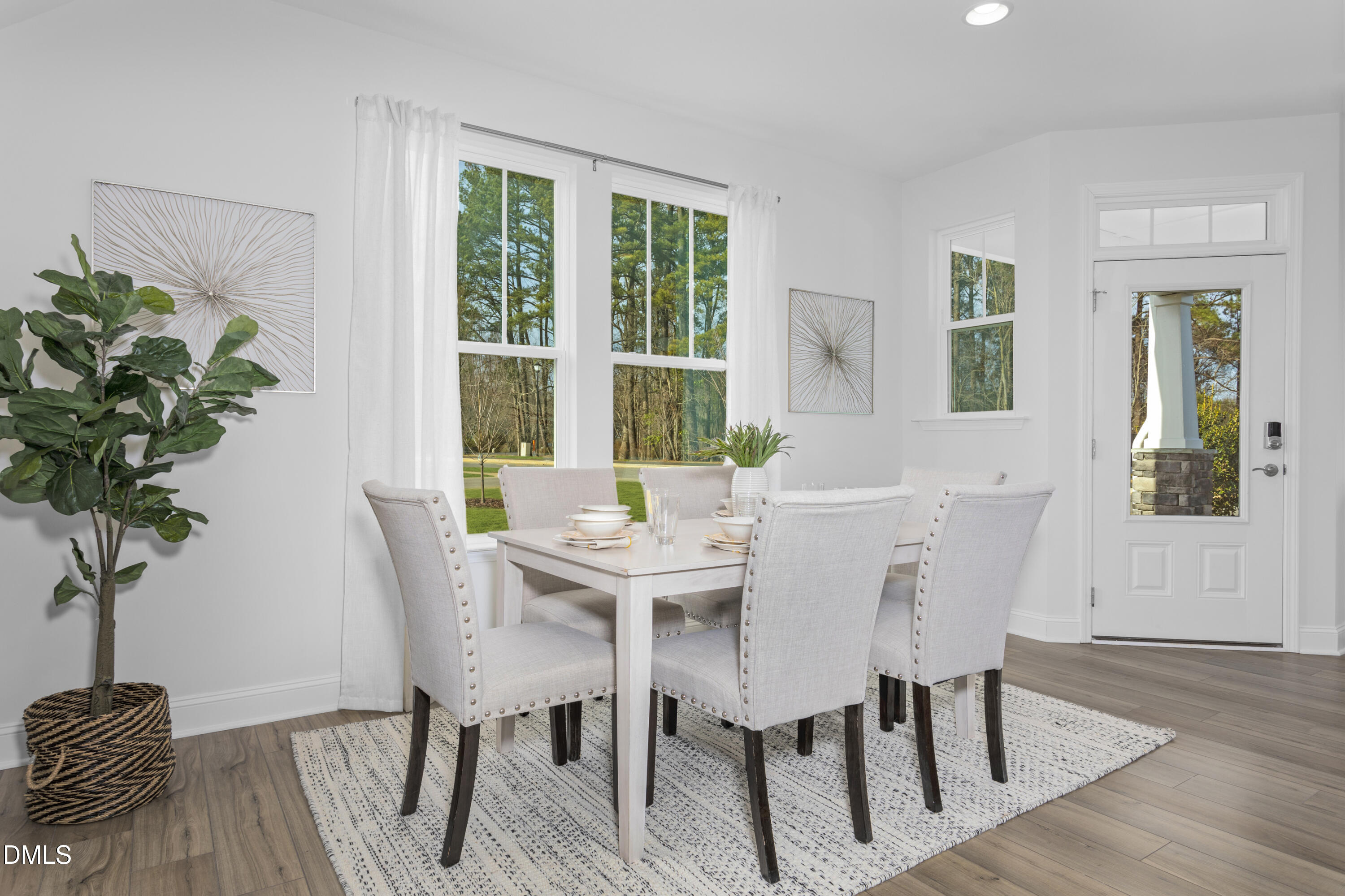 6419 Granite Quarry Drive Raleigh, NC 27610 - Photo 31 of 53 a view of a dining room with furniture window and wooden floor