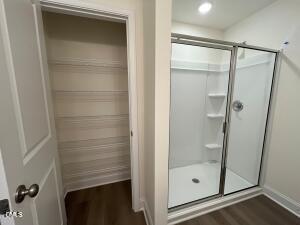 6419 Granite Quarry Drive Raleigh, NC 27610 - Photo 53 of 53 a bathroom with a glass shower door